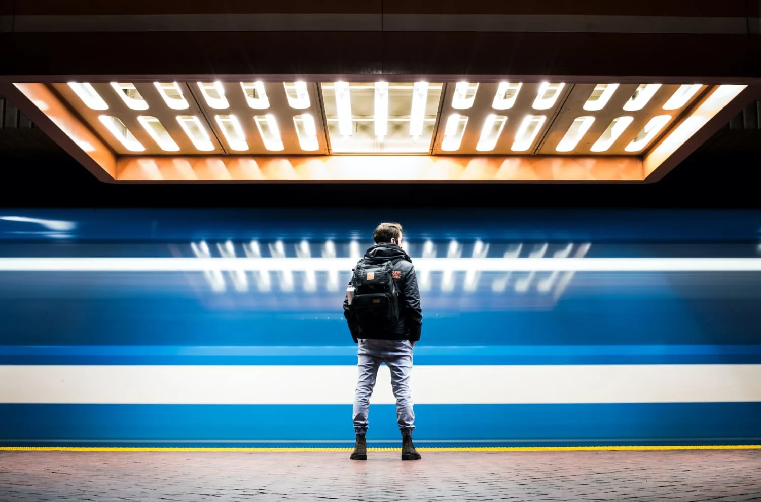 Man standing in a train station
